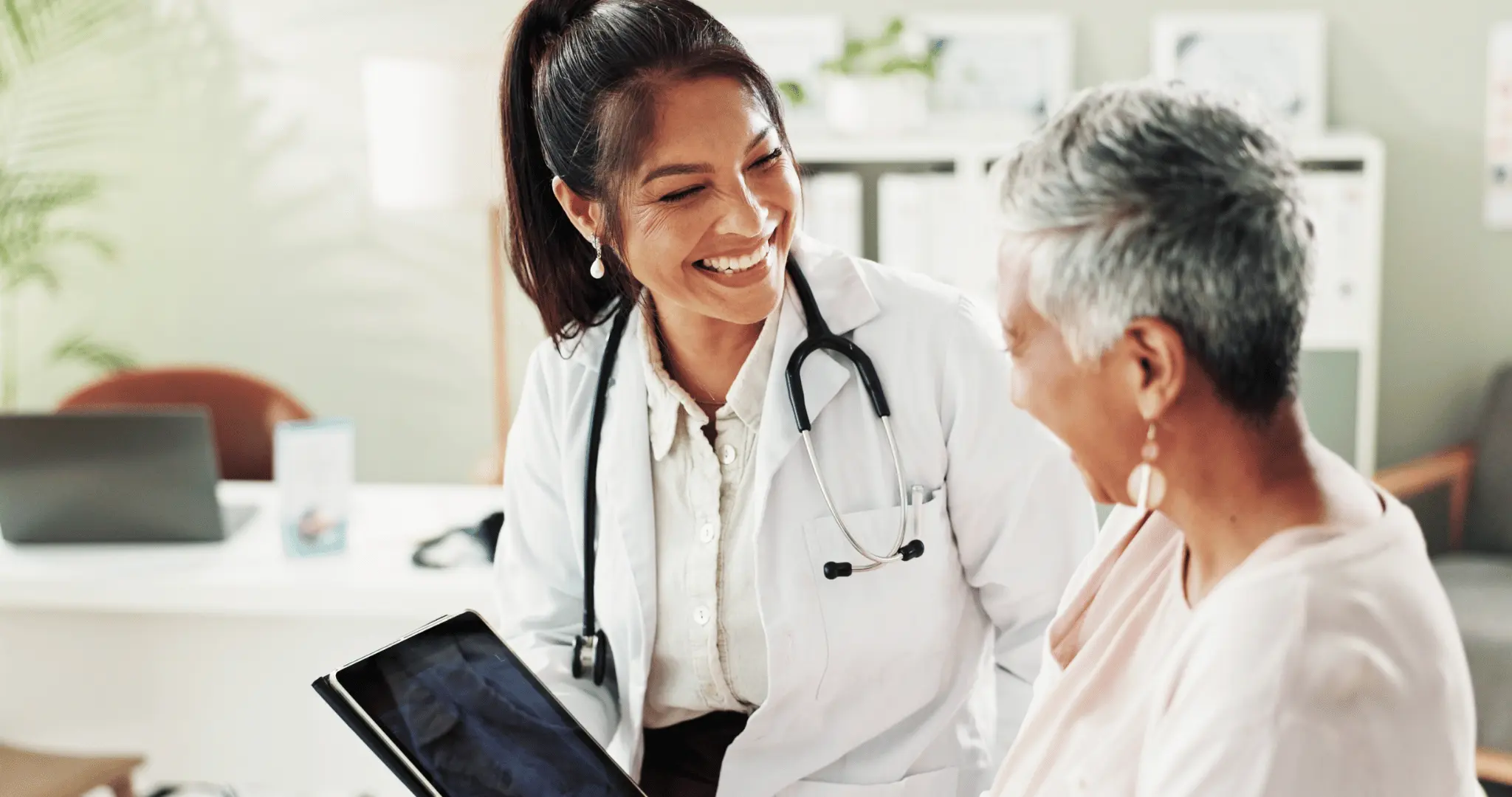 Clinician reviewing structured menopause assessment with patient during consultation